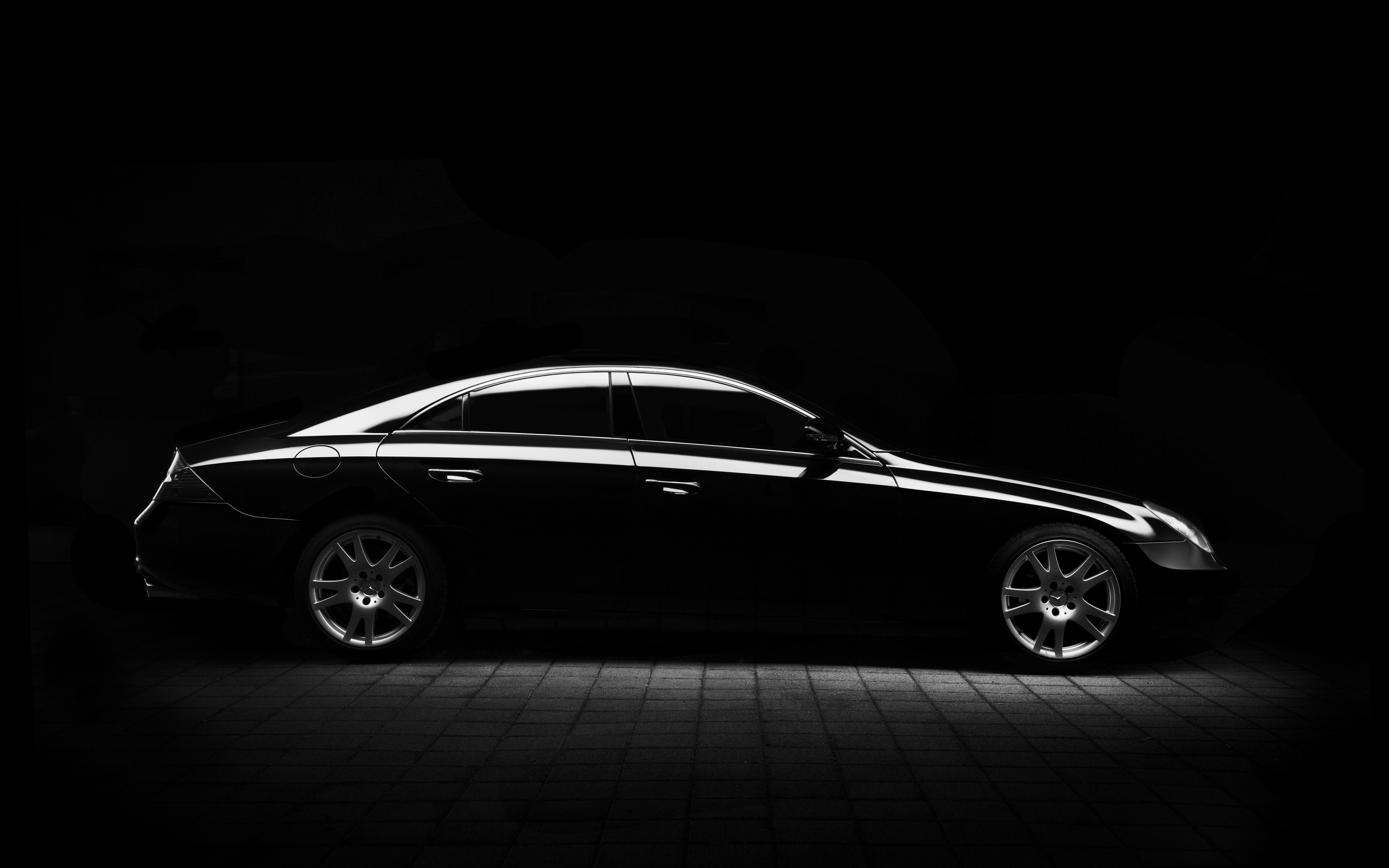 Luxury ground transportation in Europe — chauffeur-driven limousine at sunset