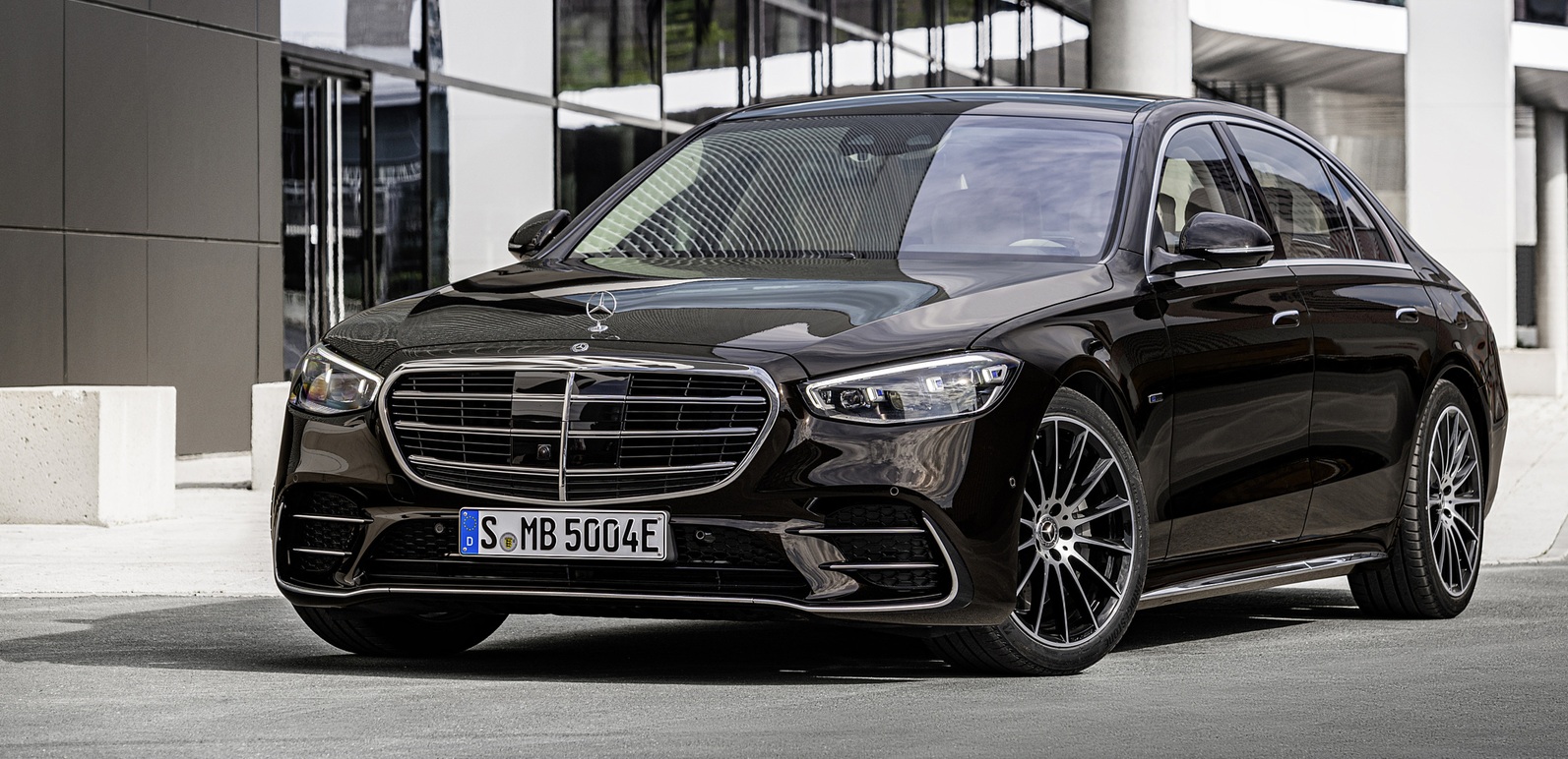 Luxury ground transportation in Europe — chauffeur-driven limousine at sunset